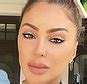 Larsa Pippen sunbathes topless in a thong and wears。